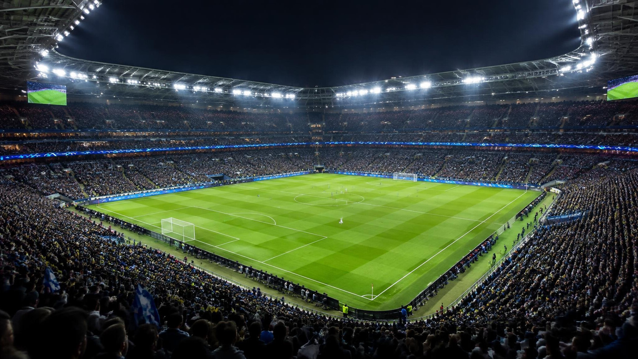 Football stadium full of fans at night