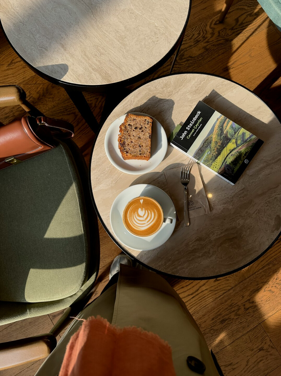 Top view of newspapers and a coffee on a wooden table