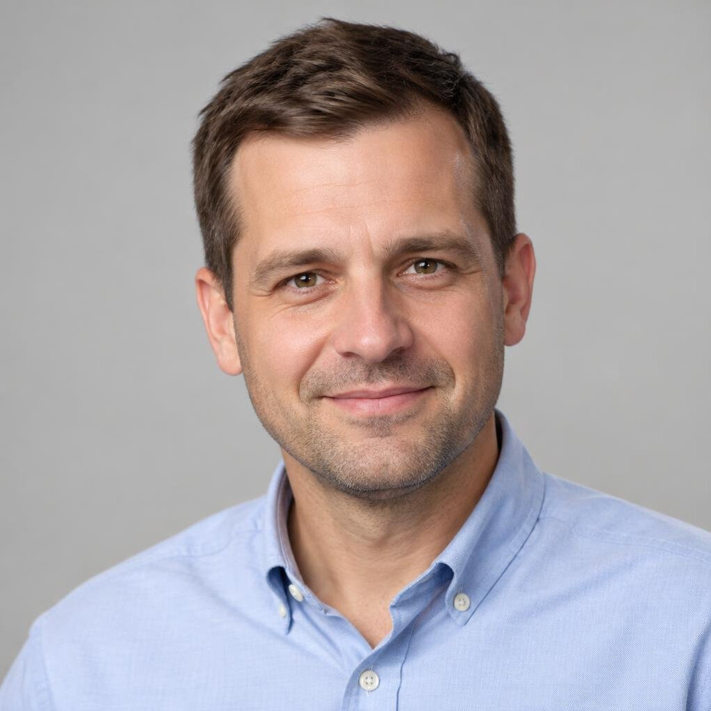 Portrait of a man in a shirt looking at the camera